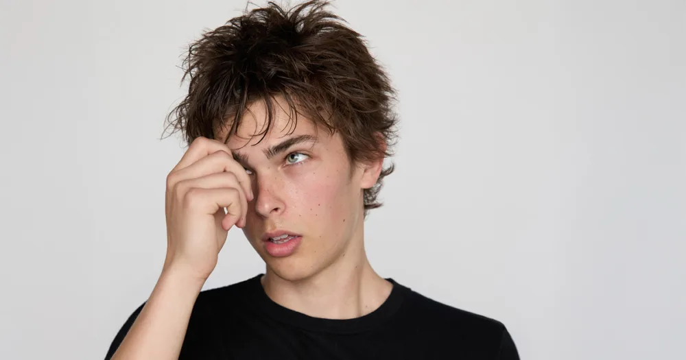 Example of modeling digitals: full-length and closeup of male model in fitted black t-shirt on plain background